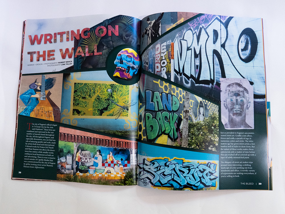 A magazine article titled 'Writing On The Wall'. The spread is full of photos of graffiti and street art.